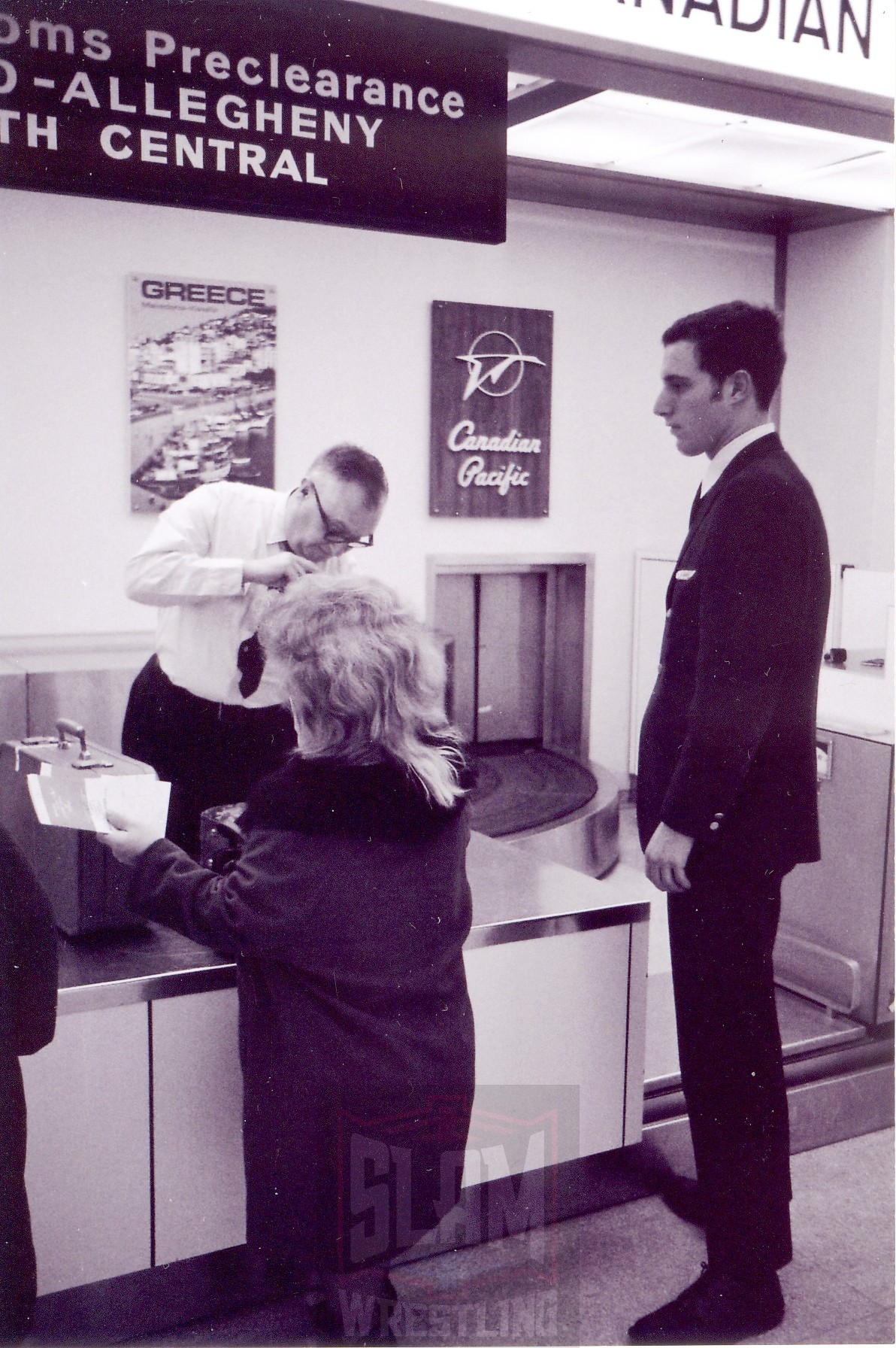 Darling Dagmar hands over her boarding pass prior to her flight to Detroit after her match in Toronto. Photo by Roger Baker