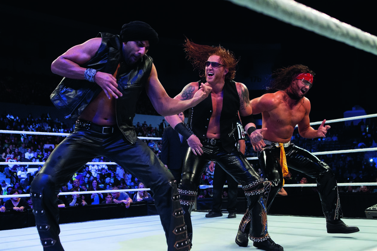 Caption from the book: WWE's resident "rock band," 3MB (Jinder Mahal, Heath Slater and me), playing a mean air guitar on Saturday Morning Slam, February 2, 2013. 