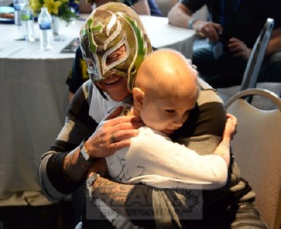 Rey Mysterio hugs Connor Michalek at WWE's Circle of Champions event with Make-A-Wish at WrestleMania 30 in New Orleans. Photo by Mike Mastrandrea