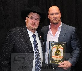 Jim Ross and Steve Austin pose with Austin's Iron Mike Award. Photo by Scott Romer