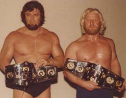 The Russian Stomper (Eric Pomeroy) and Roger Kirby as WWA tag team champions. Courtesy www.rasslinrelics.com