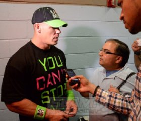 John Cena towers over SlamWrestling's Bob Kapur.