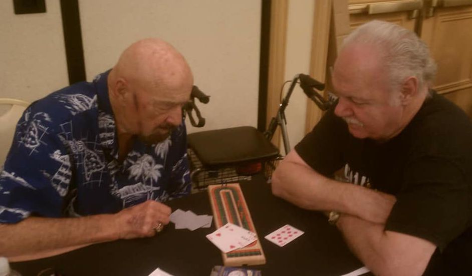 Butcher Vachon and Bill White play cribbage at a Cauliflower Alley Club reunion.