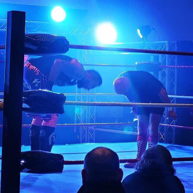 Jeremy Elliott and Eddie Dennis with a show of mutual respect during a match. Photo by Jane G.