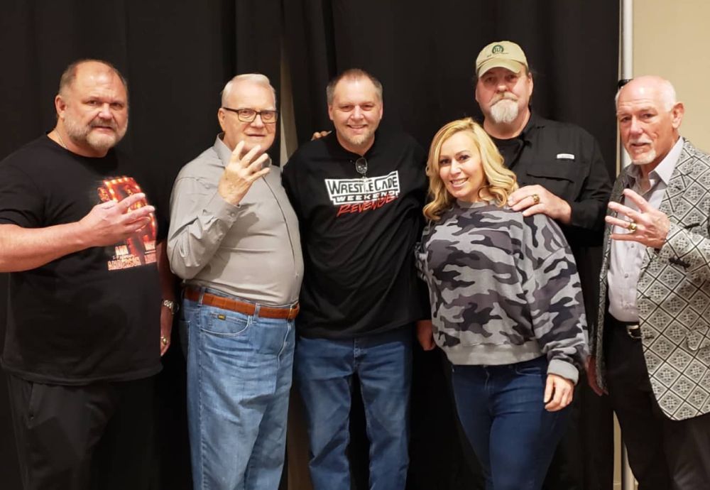 Fans pose with the Four Horsemen, from left, Arn Anderson, manager JJ Dillon, Barry Windham and Tully Blanchard at WrestleCade, November 26-28, 2021, at the Benton Convention Center in Winston-Salem, NC. Photo by Greg Mosorjak