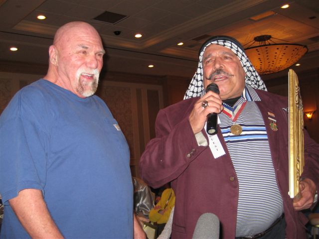 Superstar Billy Graham and the Iron Sheik at the 2009 Cauliflower Alley Club reunion. Photo by Howard Baum