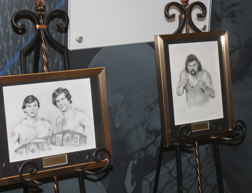 Drawings of Jerry and Jack Brisco and Gary Albright were unveiled at the Tragos/Thesz Professional Wrestling Hall of Fame induction weekend on Thursday, July 20, 2023. Photo by Greg Oliver