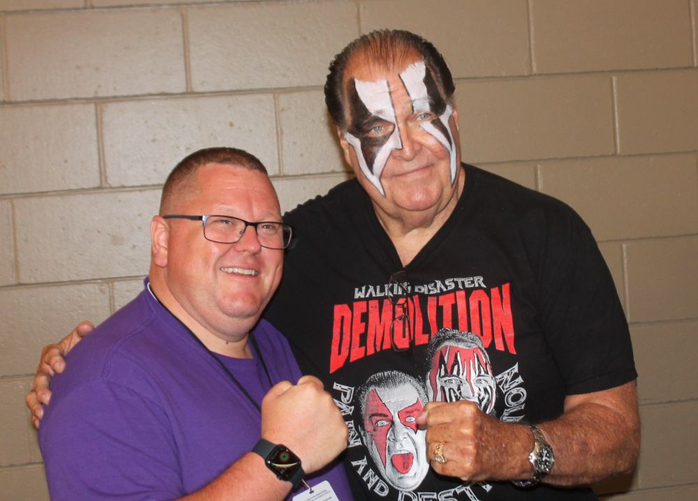 A fan meets Demolition Ax (Bill Eadie) at the Tragos/Thesz Professional Wrestling Hall of Fame induction weekend on Friday, July 21, 2023 in Waterloo, Iowa. Photo by Greg Oliver