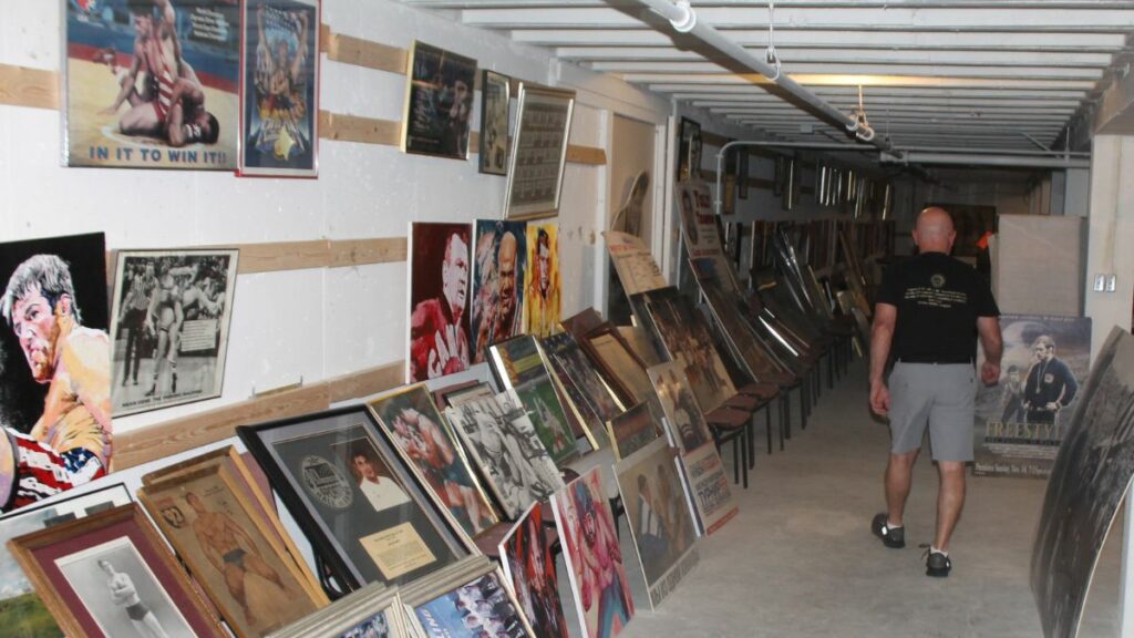 Museum Director Jim Miller wanders through the basement at the Tragos/Thesz Professional Wrestling Hall of Fame induction weekend on Saturday, July 22, 2023 in Waterloo, Iowa. Photo by Greg Oliver