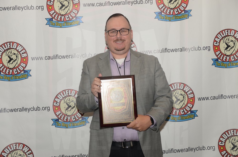Cody Kox with a posthumous award for his father, Killer Karl Kox, at the Cauliflower Alley Club Baloney Blowout on Tuesday, August 29, 2023, at the Plaza Hotel & Casino in Las Vegas. Photo by Brad McFarlin