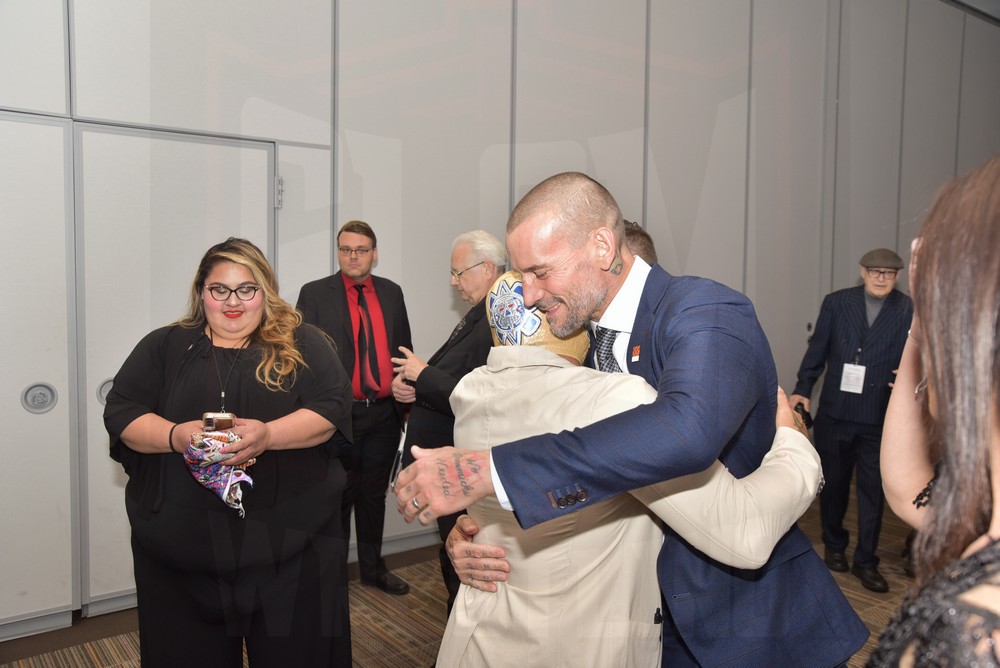 Rey Mysterio Jr. hugs CM Punk at the Cauliflower Alley Club banquet on Wednesday, August 30, 2023, at the Plaza Hotel & Casino in Las Vegas. Photo by Scott Romer
