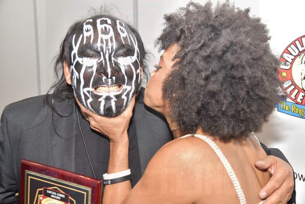 La Rosa Negra sneaks a kiss to Damian 666 at the Cauliflower Alley Club banquet on Wednesday, August 30, 2023, at the Plaza Hotel & Casino in Las Vegas. Photo by Scott Romer