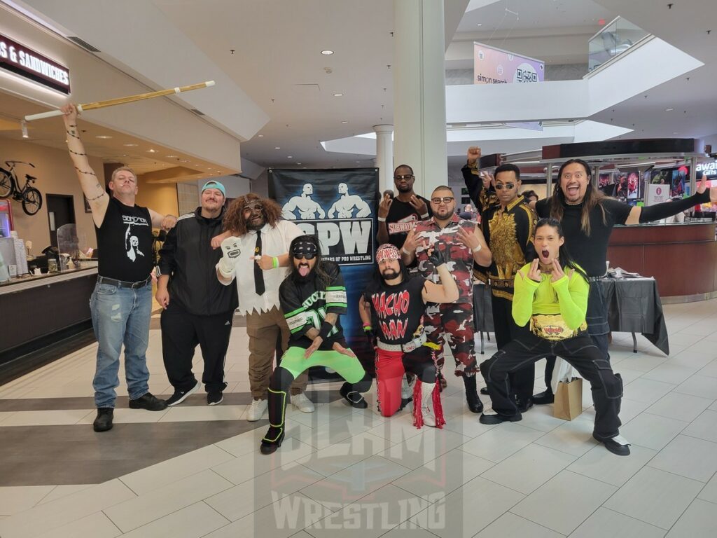 Promoter Tommy Fierro (in blue baseball hat, second from left) and fans dressed up as their favorite wrestlers at 90s Wrestling Con on Saturday, September 30, 2023, at Rockaway Townsquare, in Rockaway, New Jersey. Photo by George Tahinos, georgetahinos.smugmug.com