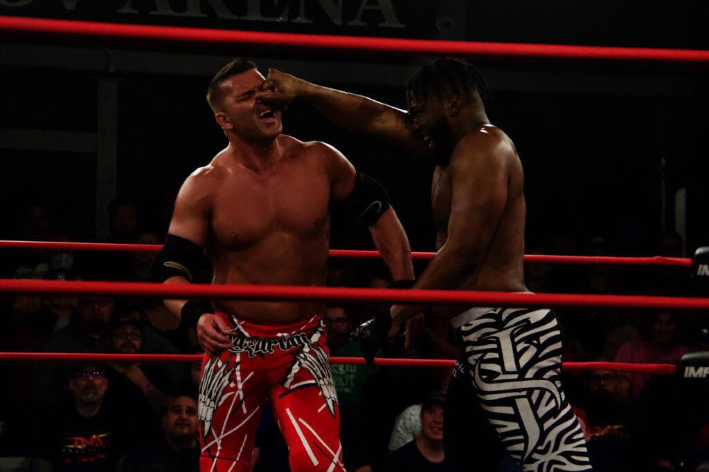 Sheldon Jean goes after the nose of Frankie Kazarian at the IMPACT Wrestling: Countdown to Final Resolution pre-show at Don Kolov Arena in Mississauga, Ontario on Sat. Dec. 9, 2023. Photo by Steve Argintaru, Twitter/Instagram: @stevetsn