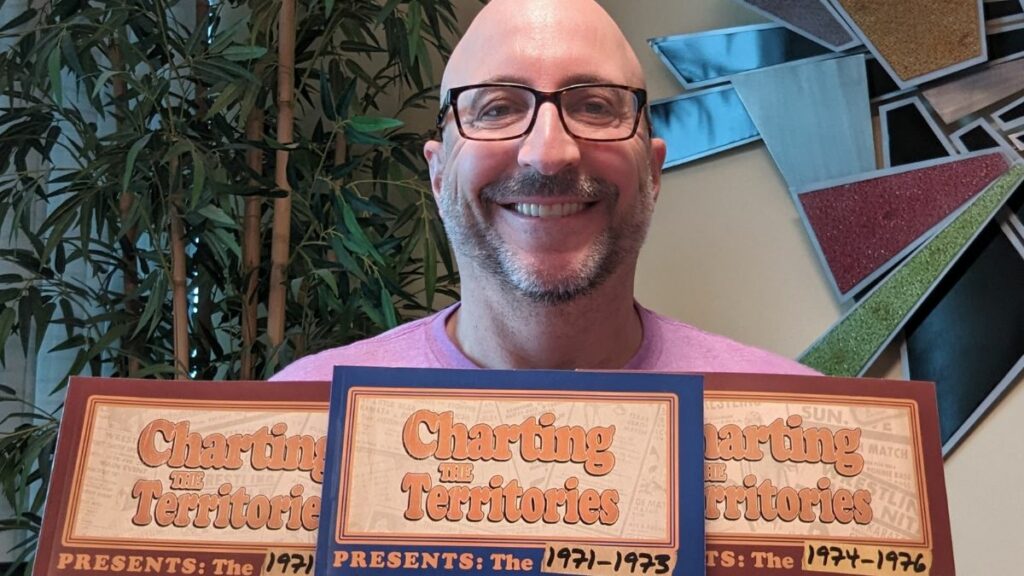 Al Getz with his Charting the Territories books.