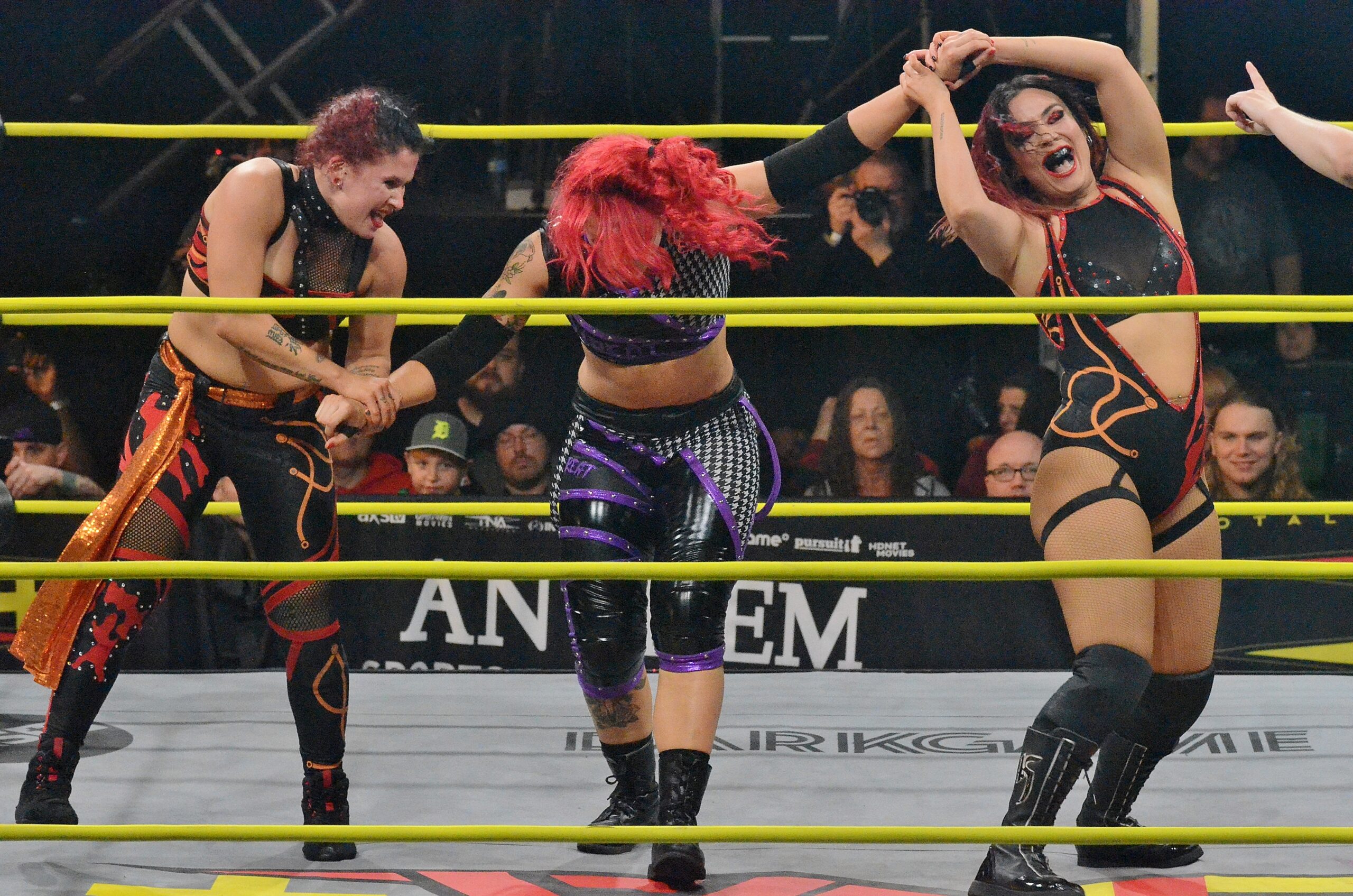 MK Ultra work together to bend Jodi Threat at TNA Sacrifice on Friday, March 8, 2024, at St. Clair College in Windsor, Ontario. Photo by Brad McFarlin