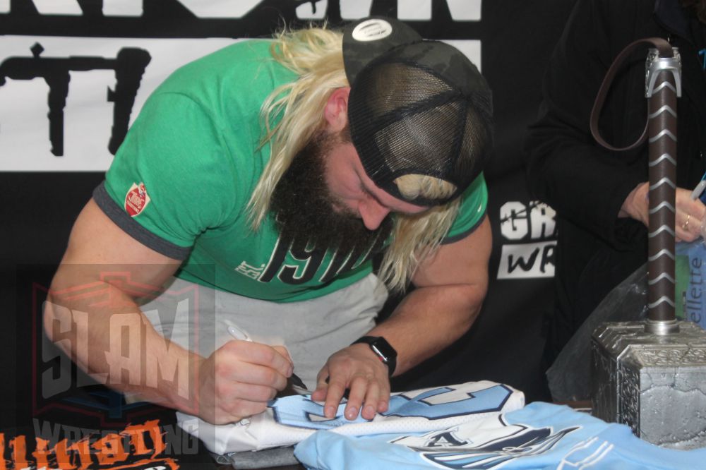 A.J. Ouellette signs autographs on March 9, 2024, at Greektown Wrestling in Toronto. Photo by Greg Oliver
