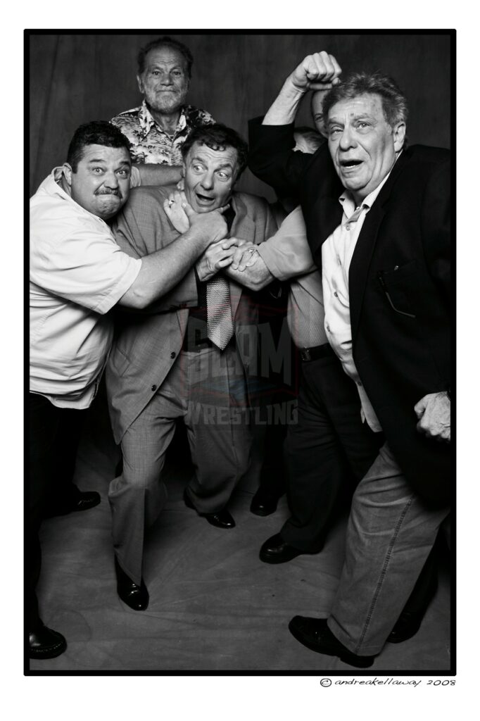 Gino Brito is mauled by Dan Gervais, the Wolfman and Milt Avruskin at the 2008 Titans in Toronto dinner. Photo by Andrea Kellaway, www.andreakellaway.com