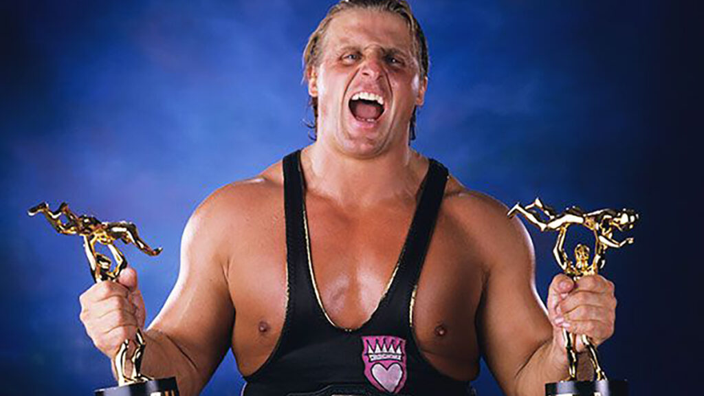 Owen Hart with his Slammy Awards