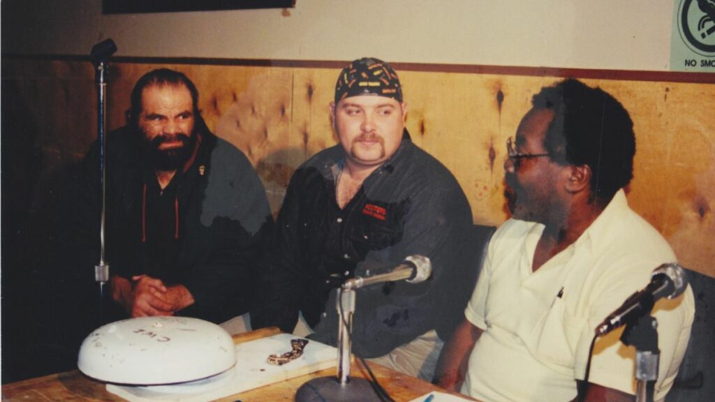 The Wolfman Willie Farkus, Justin Cassibo and Big Mac at a familiar spot at the announcers table. Terry Dart Collection