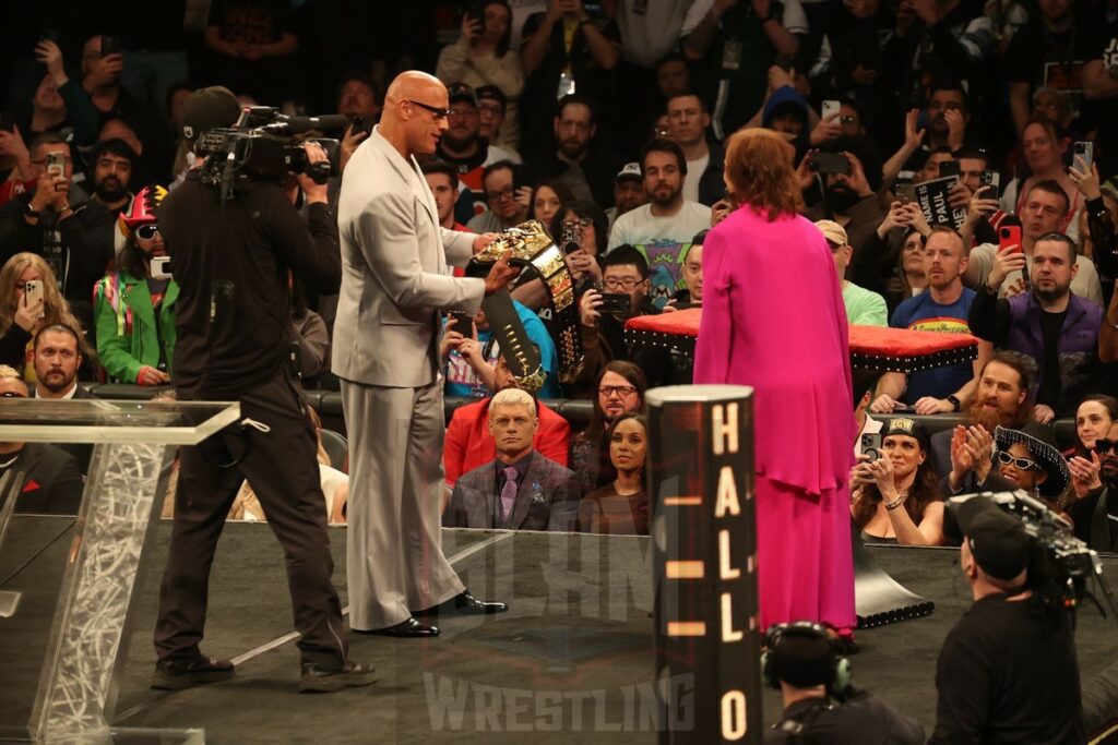 The Rock receives a People's Champion belt from Muhammad Ali's widow, Lonnie Ali, at the WWE Hall of Fame ceremony at the Wells Fargo Center in Philadelphia, PA, on Friday, April 5, 2024. Photo by George Tahinos, georgetahinos.smugmug.com