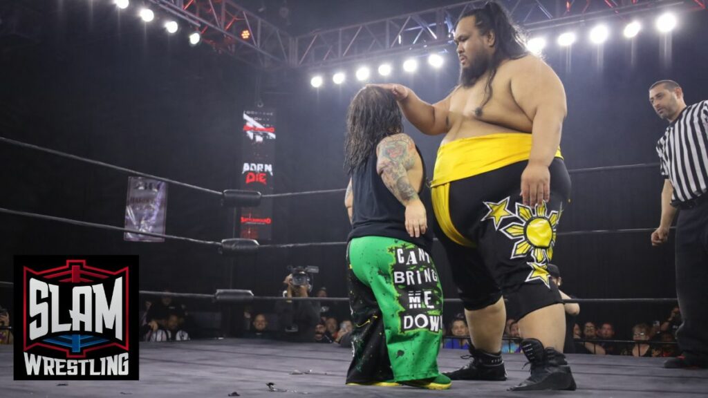 Fallah Bahh sizes up Hornswaggle at Battleground Championship Wrestling's "Born To Die" on Friday, April 5, 2024, at the 2300 Arena in Philadelphia, PA. Photo by Christine Coons, www.coonsphotography.com