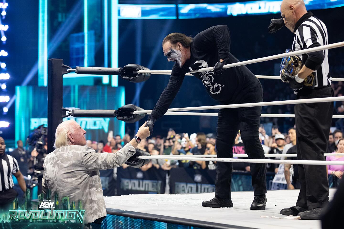 Sting and Ric Flair shake hands at AEW Revolution on March 4, 2024. AEW photo