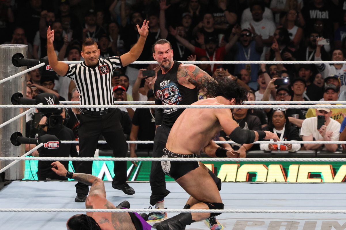 CM Punk interferes during Damian Priest vs Drew McIntyre vs Seth Rollins at the Money in the Bank PLE on Saturday, July 6, 2024, at Scotiabank Arena in Toronto. Photo by Steve Argintaru, Twitter/IG: @stevetsn