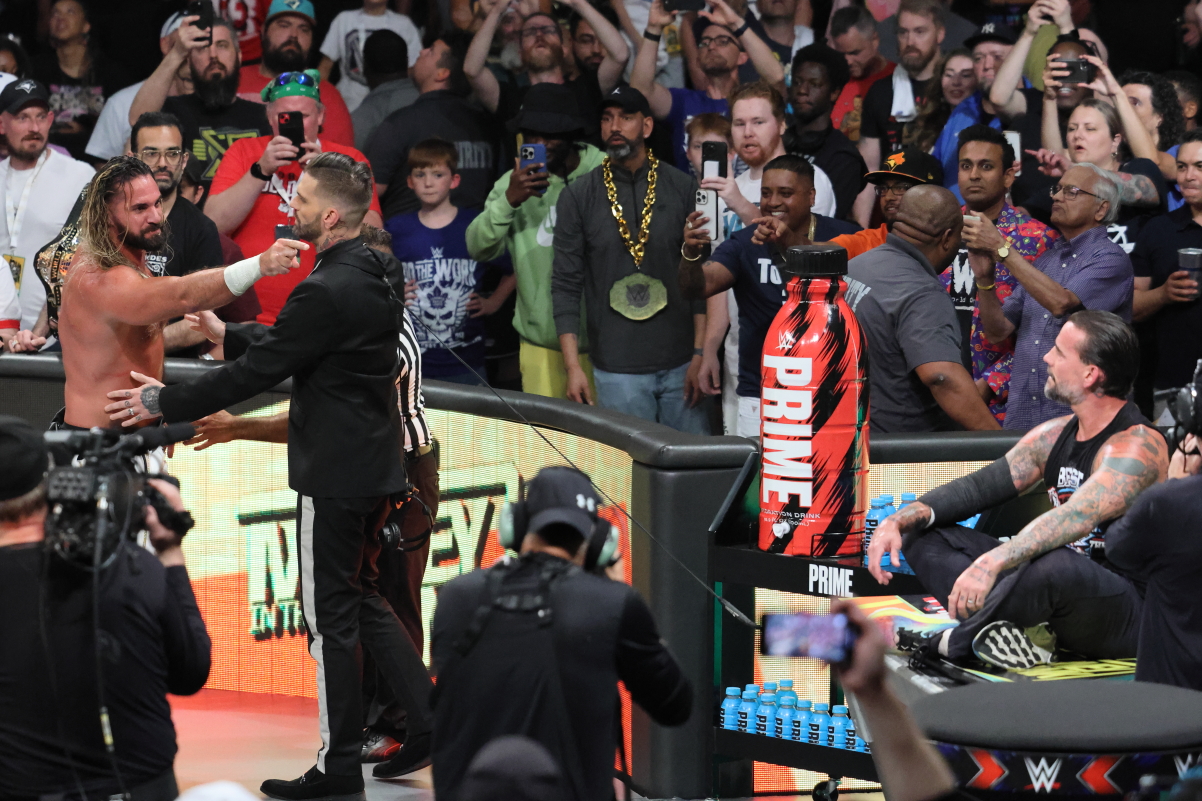 Corey Graves stands between Seth Rollins and CM Punk at the Money in the Bank PLE on Saturday, July 6, 2024, at Scotiabank Arena in Toronto. Photo by Steve Argintaru, Twitter/IG: @stevetsn