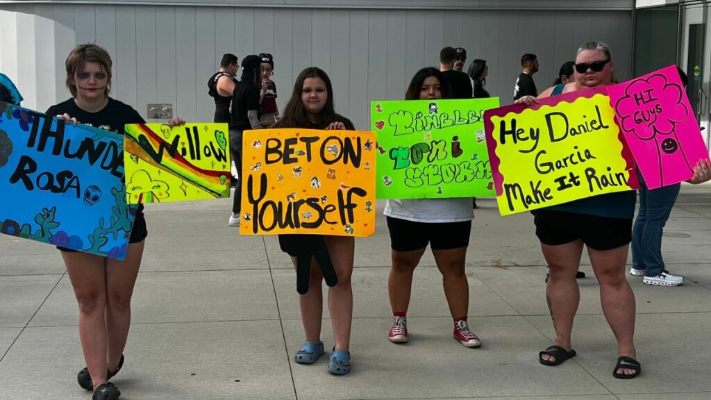 Fans with signs at AEW Dynamite in Chicago on July 3, 2024. Photo by Gio Alvarez