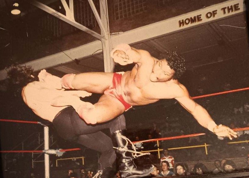 Gary Jackson with a dropkick on Eli the Eliminator.