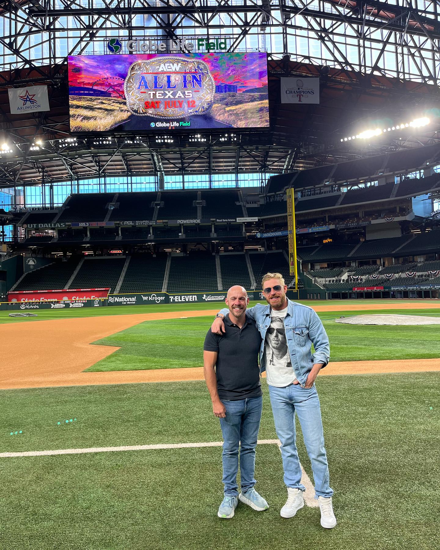 Referee Bryce Remsburg and Orange Cassidy on the field at the announcement of All In for 2025 at Globe Life Field in Arlington, Texas. Bryce Remsburg Facebook photo