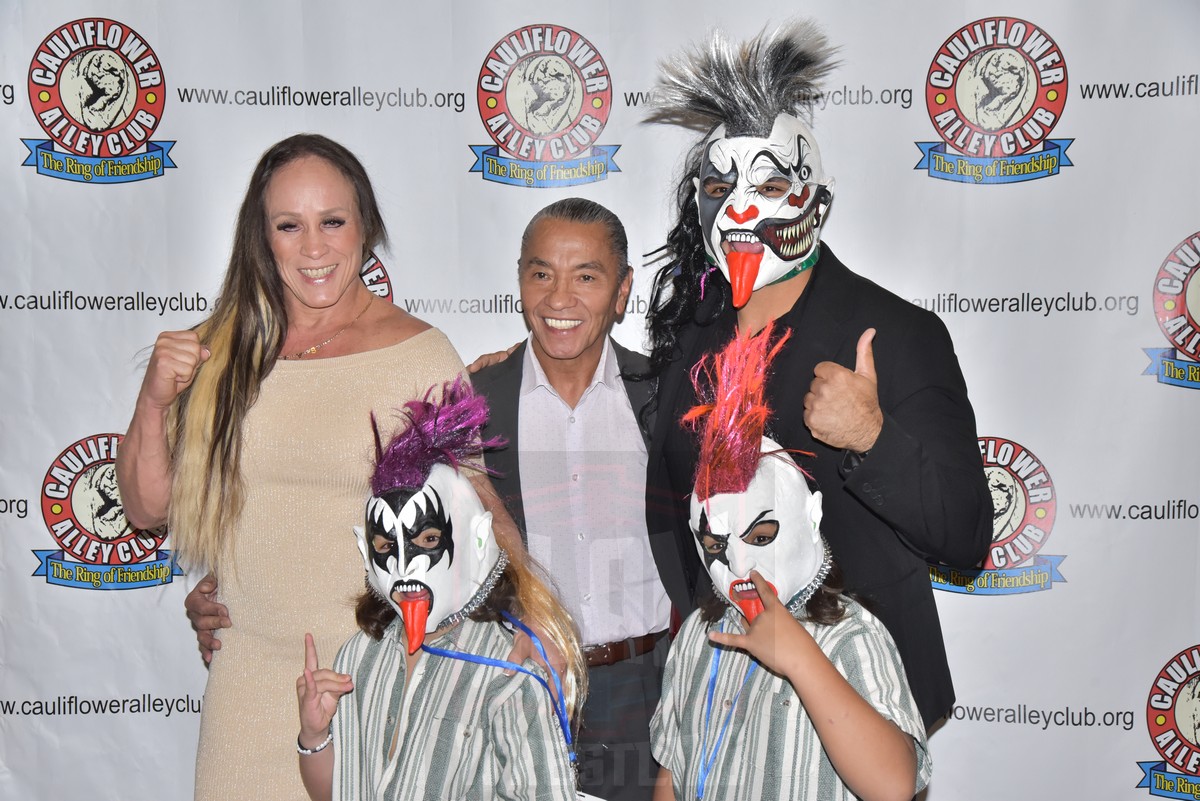 Lucha Award winner Negro Casas, center, with his wife, Dalys la Caribeña, his presenter/son-in-law Psycho Clown and Casas' grandchildren at the Cauliflower Alley Club reunion at the Plaza Hotel & Casino in Las Vegas on Wednesday, August 21, 2024. Photo by Scott Romer