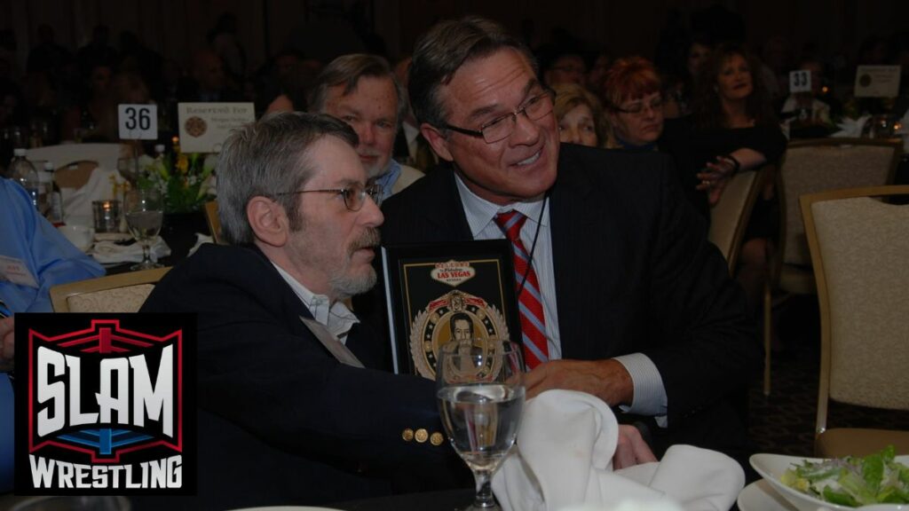 Dennis Brent with his Cauliflower Alley Club Melby Award, along with his presenter Terry Taylor, in April 2015. Photo by Brad McFarlin