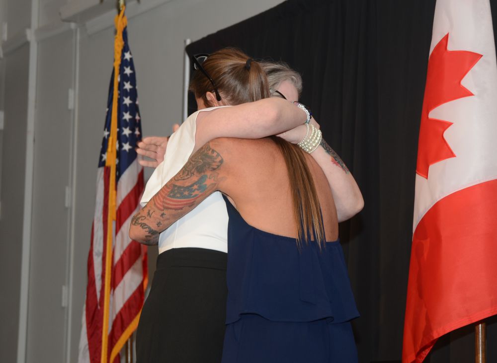 Allison Danger gets a hug from co-emcee Madusa at the Cauliflower Alley Club reunion banquet at the Plaza Hotel & Casino in Las Vegas on Tuesday, August 20, 2024. Photo by Brad McFarlin