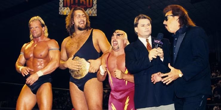 An odd WCW mix with Lex Luger, The Giant (Paul Wight, the future Big Show), Kevin Sullivan, announcer Tony Schiavone and Jimmy Hart. 