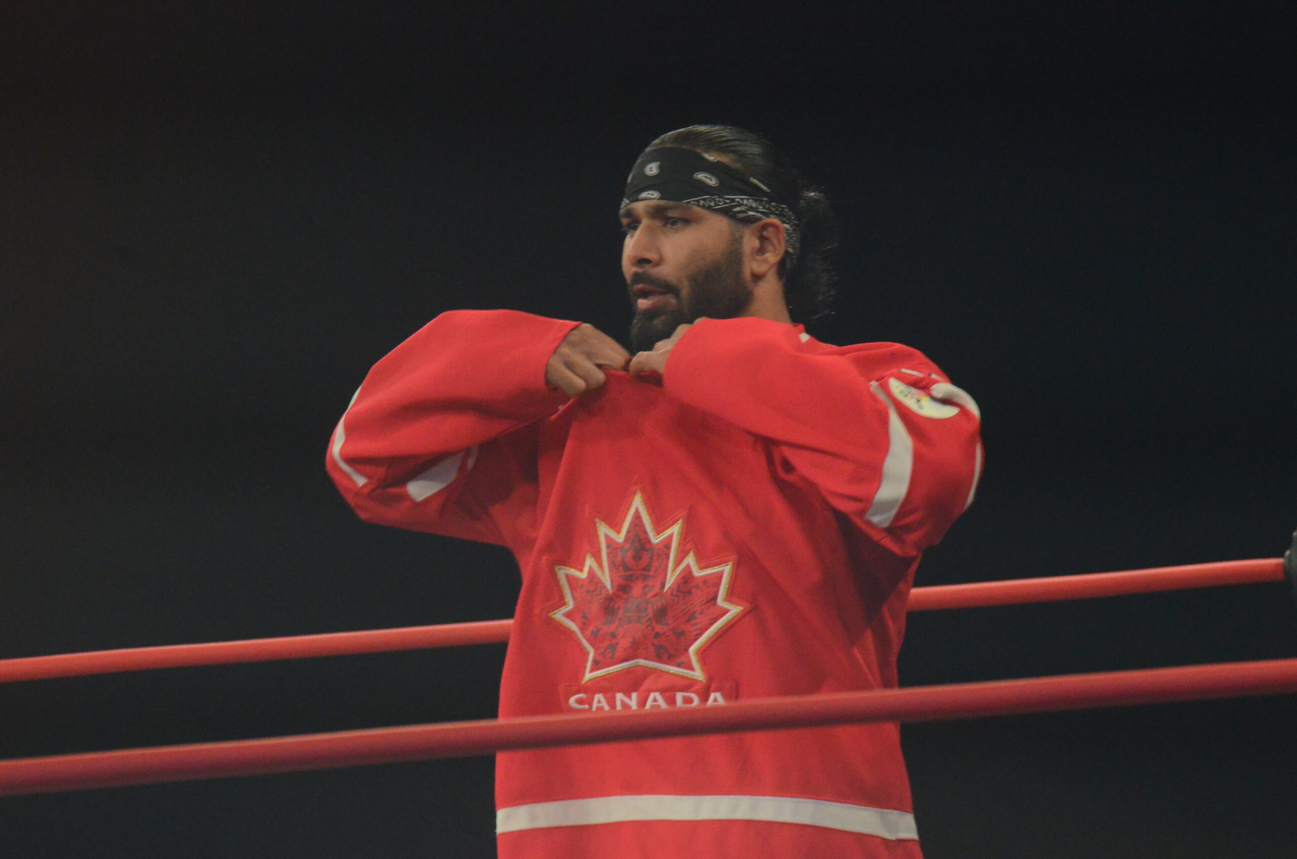 Bhupinder Gujjar shows off his love for Canadian hockey before wrestling QT Marshall at the debut of Maple Leaf Pro Wrestling at St. Clair College in Windsor, Ontario, on Saturday, October 19, 2024. Photo by Brad McFarlin