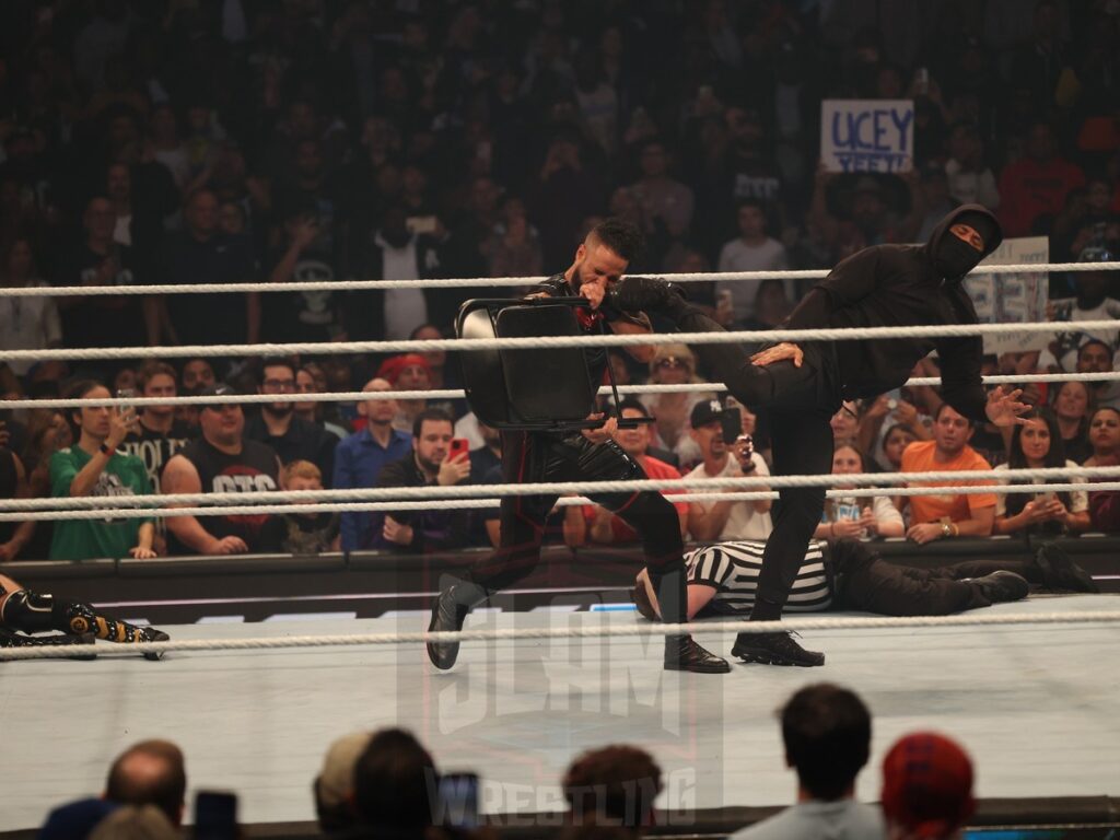 A mysterious figure interrupts the Tag Team Championship match between The Bloodline vs Motor City Machine Guns (Chris Sabin and Alex Shelley) at WWE Smackdown on Friday, October 25, 2024, at the Barclays Center in Brooklyn, NY. Photo by George Tahinos, https://georgetahinos.smugmug.com