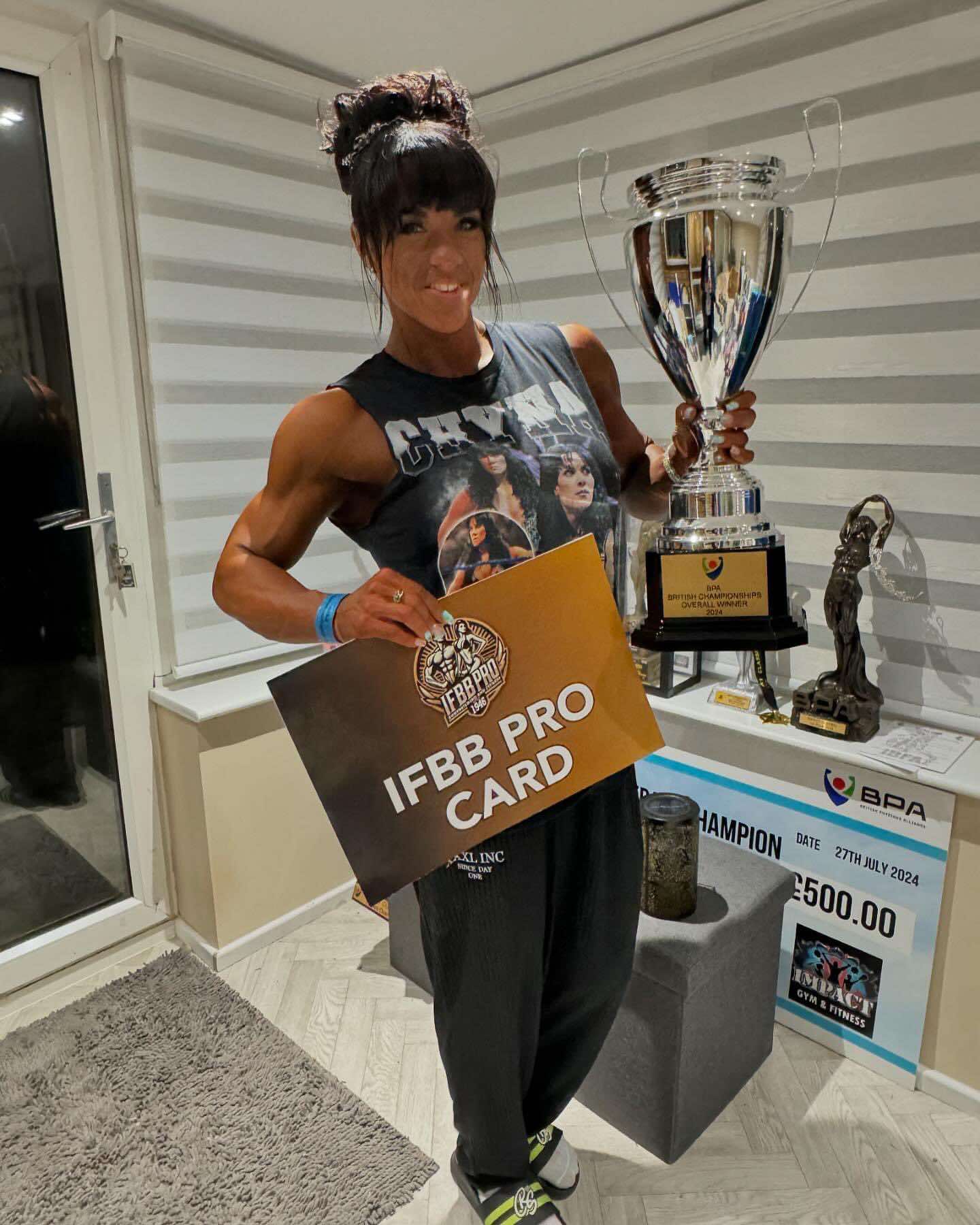 Sarah Page celebrates getting her IFBB Pro Card