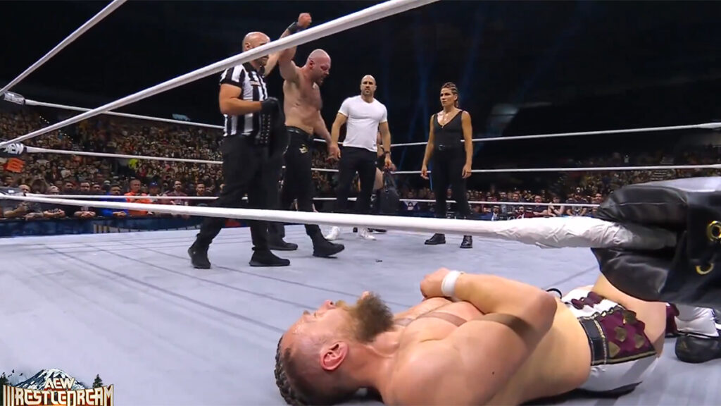 Jon Moxley and Marina Shafir stand over a beaten Bryan Danielson at AEW WrestleDream at the Tacoma Dome, in Tacoma, Wash., on Saturday, October 12, 2024. AEW photo