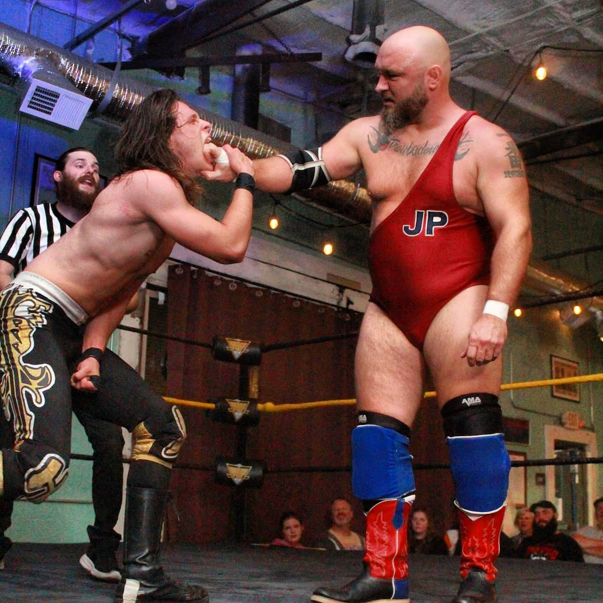 Jeremiah Plunkett picks Hunter Drake up by his lower mandible at NWA Kross Fire Wrestling on November 15, 2024, in Maryville, TN. Photo by Terry Maples