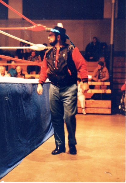 Jonathan "Fuzzy" Sayers as a manager at ringside.