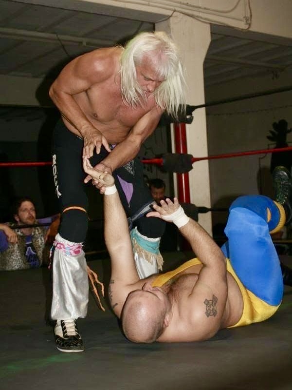 Ricky Morton ties up Jeremiah Plunkett in Seymour, Tennessee, as Danny Dealz watches on.