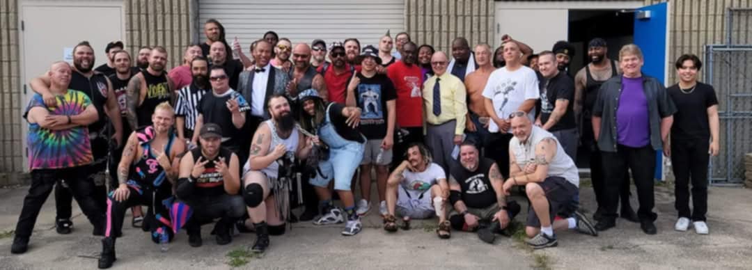 RoughHouse surrounded by Detroit wrestling colleagues.