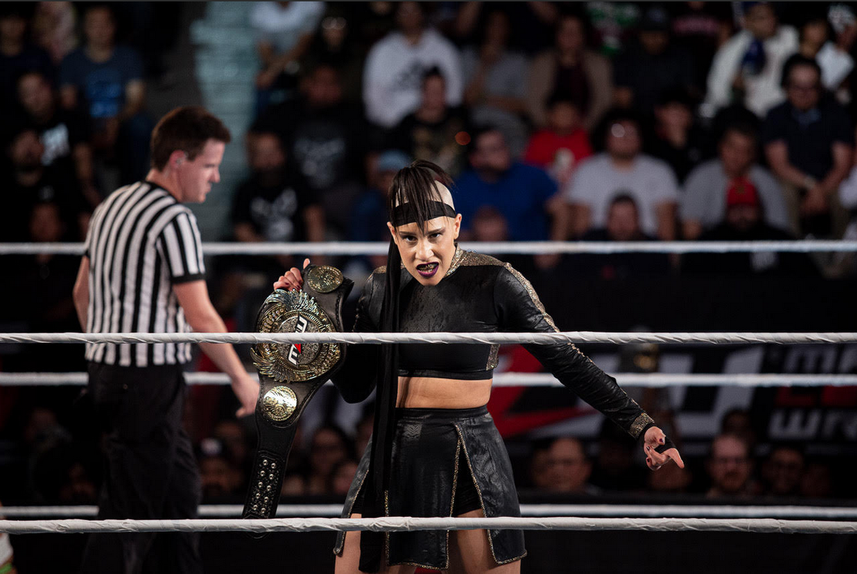 Janai Kai poses with her MLW Featherweight title belt in the ring. Photo courtesy of MLW.