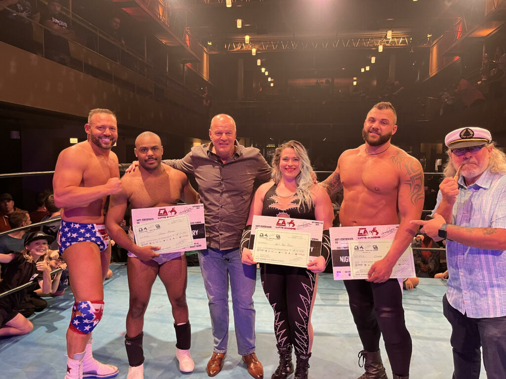 Jacques Rougeau( middle), QT Marshall (left) with the winners of Lutte Academie 2023, Shaun Moore (middle left), Kat Von Heez (middle right) and Jesse V (middle far right).